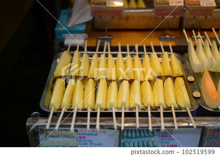 Pineapples for sale at the market 102519599
