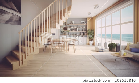 Bright living room of a house by the sea with a staircase to the second floor and a view of the first line of the beach with waves. 102519816