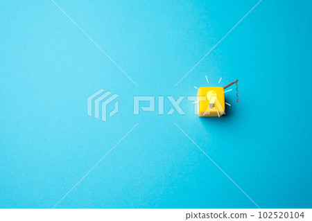 Light bulb on with chain switch. The new idea or inspiration being sparked. Choice made. Ingenuity and creativity. Eureka moment 102520104