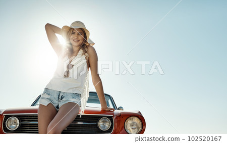 The summer sun is always enjoyable. an attractive young woman on a road trip. 102520167