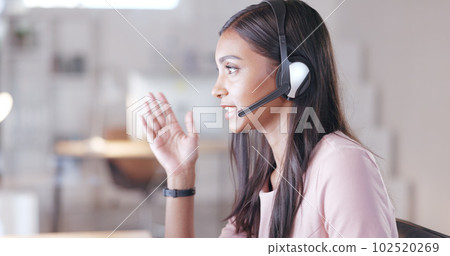 Talking call centre agent wearing headset in office and promoting or marketing deals and sales to clients. Assertive and confident customer service operator helping, explaining and advising customers Talking call centre agent wearing headset in office and promoting or marketing deals and sales to clients. Assertive and confident customer service operator helping, explaining and advising customers 102520269
