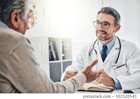 Describing his symptoms in detail. a friendly doctor consulting with a mature patient in his office. 102520543