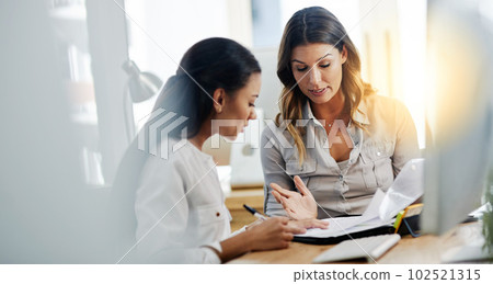 Business woman, notebook and partnership with discussion, planning or paperwork in office together. Women, teamwork and talking with documents, notes or schedule in workplace for collaboration at job Business woman, notebook and partnership with discussion, planning or paperwork in office together. Women, teamwork and talking with documents, notes or schedule in workplace for collaboration at job 102521315