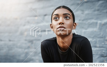 young woman, workout and thinking of training or routine or fitness and isolated on grey wall outdoors. Exercise, marathon and female runner or vision for wellness or outside and mock up background 102521356