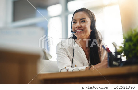 Communication, crm or happy woman in call center consulting, speaking or talking at customer services. Virtual assistant, friendly or sales consultant in telemarketing or telecom company help desk 102521380