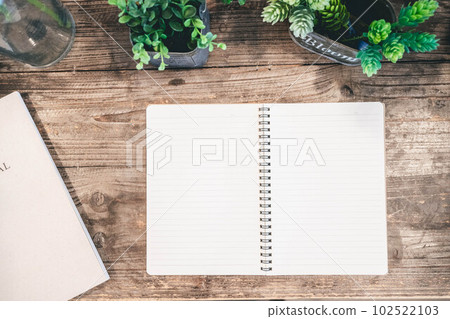 wooden desk and notebook 102522103