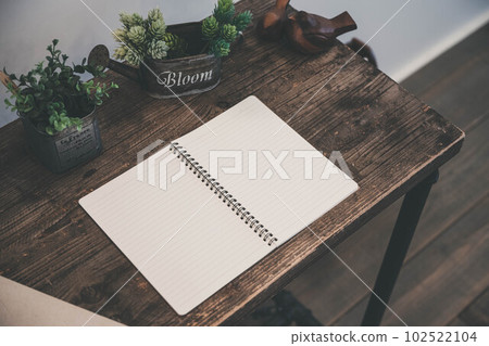 wooden desk and notebook 102522104