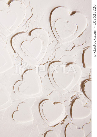 Pastel colored wallpaper, background, design, banner. Creative image of sand, powder with imprint and textures of hearts. Pastel colored wallpaper, background, design, banner. Creative image of sand, powder with imprint and textures of hearts. 102523226