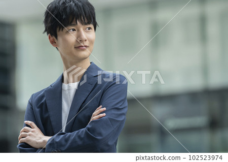 Young man with folded arms casual business image portrait Young man with folded arms casual business image portrait 102523974