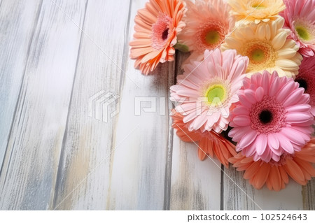 Colorful gerbera daisy bouquet on white wooden background, copy space for text. Pink, orange, red flowers. Floral greeting card mockup for Mother's Day, Valentine's, Wedding invitation. Generative AI 102524643
