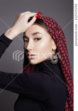 beautiful young woman in color veil and jewelry. beauty girl in color hijab beautiful young woman in color veil and jewelry. beauty girl in color hijab 102525205