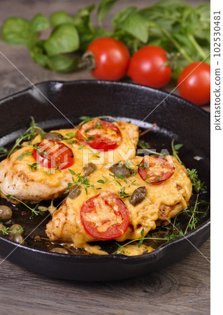 Chicken breast with cheese and tomatoes Chicken breast with cheese and tomatoes 102530481