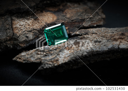 yellow sapphire on old wooden with black background 102531430