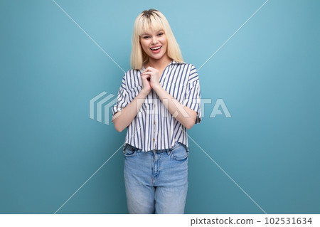 stylish caucasian skinny blond young lady in casual outfit in studio stylish caucasian skinny blond young lady in casual outfit in studio 102531634