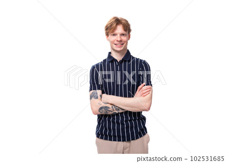 stylish handsome young blond man with tattoos on his arm on a white background stylish handsome young blond man with tattoos on his arm on a white background 102531685
