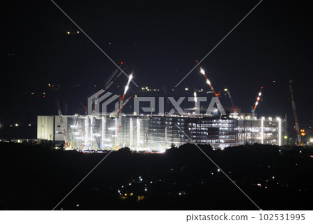 Construction site night view telephoto 102531995