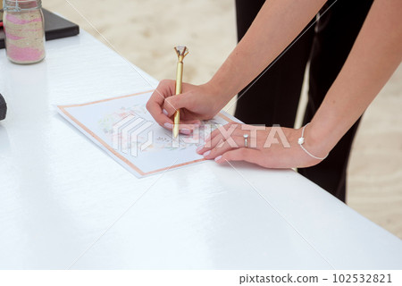 The bride signs the certificate of marriage. Mexico. The bride signs the certificate of marriage. Mexico. 102532821