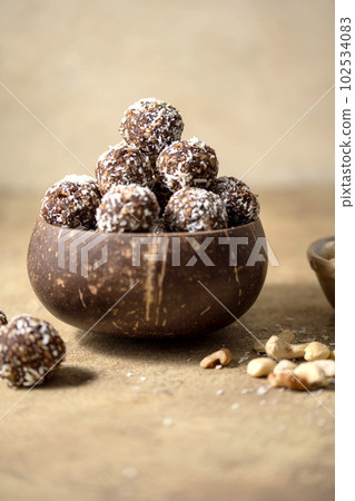Energy balls. No cook energy protein, bites made from coconut flakes, oats, dried fruits and nuts. 102534083