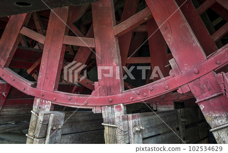 detail of wooden paddle wheel of Captain Meriwether Lewis sidewheeler dredge displayed in a dry dock in Brownville, Nebraska 102534629