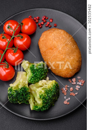 Delicious baked cutlet breaded with spices, salt and herbs Delicious baked cutlet breaded with spices, salt and herbs 102535482