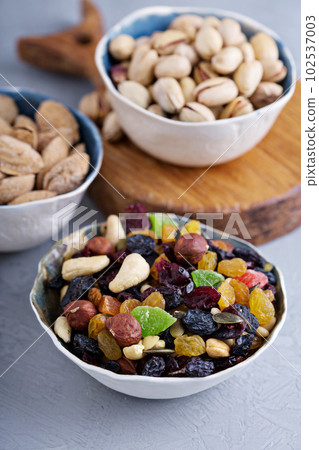 Mixed nuts and fruits in a bowl Mixed nuts and fruits in a bowl 102537003
