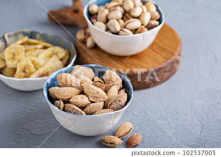 Salted almonds and pistachios in a shell Salted almonds and pistachios in a shell 102537005