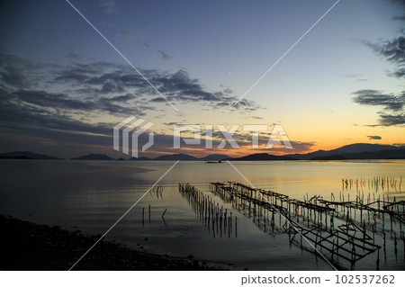 Autumn sunset in Setouchi lined with oyster shelves and Hoboro Island 102537262