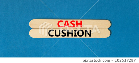 Cash cushion symbol. Concept words Cash cushion on beautiful wooden stick. Beautiful blue table blue background. Business and Cash cushion concept. Copy space. Cash cushion symbol. Concept words Cash cushion on beautiful wooden stick. Beautiful blue table blue background. Business and Cash cushion concept. Copy space. 102537297
