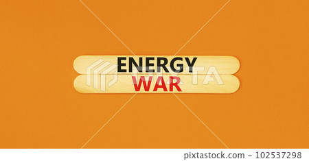 Energy war symbol. Concept words Energy war on beautiful wooden stick. Beautiful orange table orange background. Business and Energy war concept. Copy space. Energy war symbol. Concept words Energy war on beautiful wooden stick. Beautiful orange table orange background. Business and Energy war concept. Copy space. 102537298