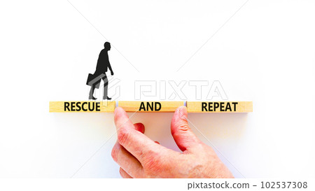 Rescue and repeat symbol. Concept words Rescue and repeat on wooden block on a beautiful white table white background. Businessman hand. Business rescue and repeat concept. Copy space. Rescue and repeat symbol. Concept words Rescue and repeat on wooden block on a beautiful white table white background. Businessman hand. Business rescue and repeat concept. Copy space. 102537308