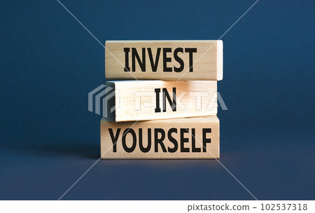 Invest in yourself symbol. Concept words Invest in yourself on wooden block on a beautiful grey table grey background. Business and Invest in yourself concept. Copy space. 102537318