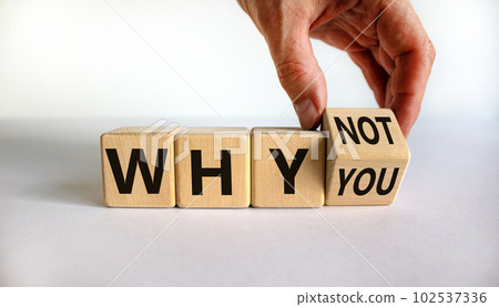 Why not you symbol. Businessman turns a cube and changes words why you to why not. Beautiful white background. Business and why not you concept. Copy space. Why not you symbol. Businessman turns a cube and changes words why you to why not. Beautiful white background. Business and why not you concept. Copy space. 102537336