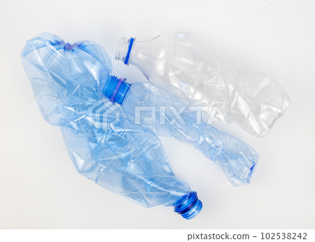 Used plastic bottles on a white background. The concept of recycling plastic waste. Used plastic bottles on a white background. The concept of recycling plastic waste. 102538242
