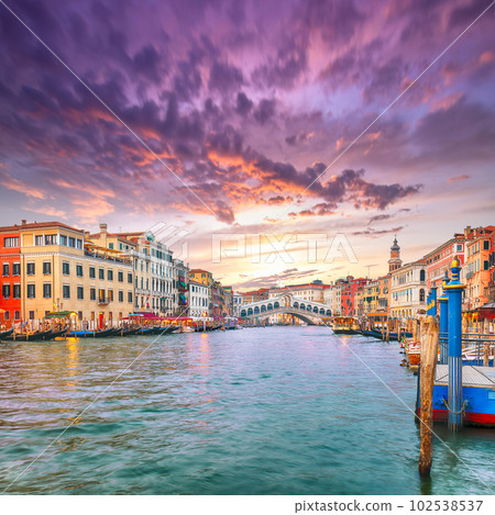 Amazing sunset and evening cityscape of Venice with famous Canal Grande and Rialto Bridge 102538537