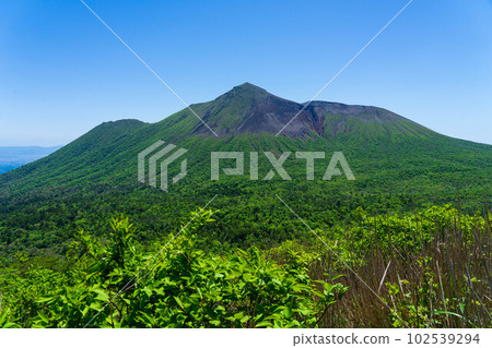 Takachiho peak in dark green in early summer 102539294