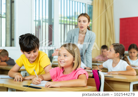 Schoolchildren performing test Schoolchildren performing test 102544279