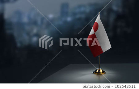 A small Greenland flag on an abstract blurry background 102548511