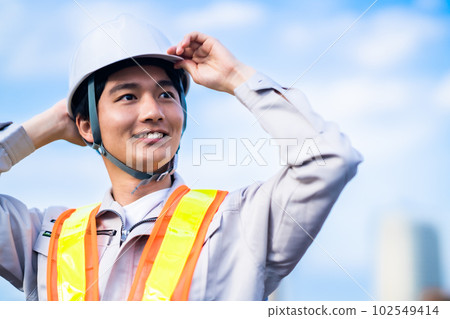 Young male engineer in helmet 102549414