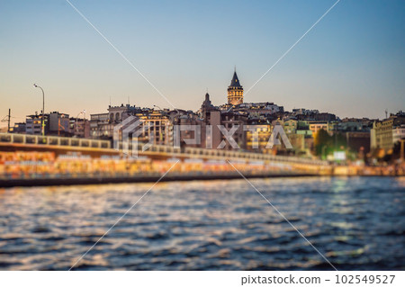 Istanbul city skyline in Turkey, Beyoglu district old houses with Galata tower on top, view from the Golden Horn Istanbul city skyline in Turkey, Beyoglu district old houses with Galata tower on top, view from the Golden Horn 102549527