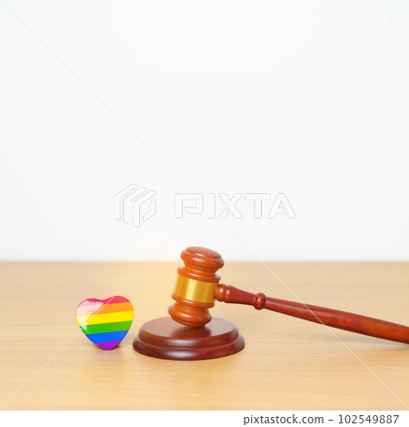 LGBT Law and Pride month concepts. gavel justice hammer with rainbow colorful heart shape for Lesbian, Gay, Bisexual, Transgender, Queer, Intersex, Asexual, Agender, Non Binary, Two Spirit, Pansexual 102549887