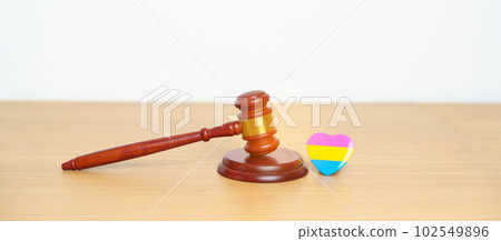 Pansexual Pride Day, LGBTQ Law and Pride month concepts. gavel justice hammer with pink, yellow and blue heart shape for Lesbian, Gay, Bisexual, Transgender, Queer, Intersex 102549896