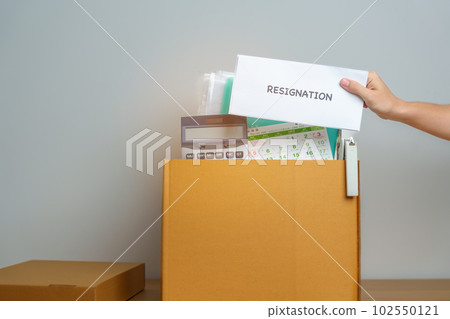 Resignation, Layoff, Unemployment, Dismiss, Job quit, Jobless and Farewell concept. Businesswoman holding letter of Resign contract with documents cardboard box at office Resignation, Layoff, Unemployment, Dismiss, Job quit, Jobless and Farewell concept. Businesswoman holding letter of Resign contract with documents cardboard box at office 102550121