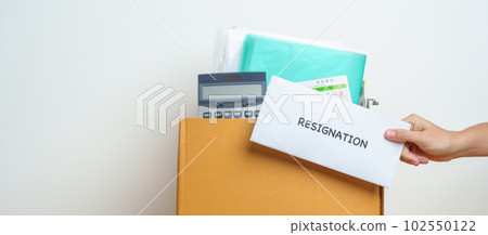 Resignation, Layoff, Unemployment, Dismiss, Job quit, Jobless and Farewell concept. Businesswoman holding letter of Resign contract with documents cardboard box at office Resignation, Layoff, Unemployment, Dismiss, Job quit, Jobless and Farewell concept. Businesswoman holding letter of Resign contract with documents cardboard box at office 102550122