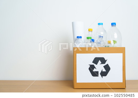 Plastic bottle in paper box at home or office. Recycle garbage Sorting. Plastic Free, Ecology, Environmental, pollution, Dispose recycling, waste management and trash Separation concept Plastic bottle in paper box at home or office. Recycle garbage Sorting. Plastic Free, Ecology, Environmental, pollution, Dispose recycling, waste management and trash Separation concept 102550485