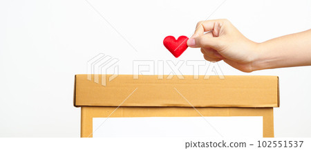Organ Donation, Charity, Volunteer, Giving and blood Concept. Hand holding red heart into donate box for support poor, homeless, CSR social responsibility, world heart and  mental health day 102551537