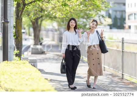 OL business walking outside OL business walking outside 102552774