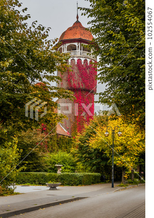 Old water tower, one of the symbols of the city Svetlogorsk at autumn. Russia Old water tower, one of the symbols of the city Svetlogorsk at autumn. Russia 102554067