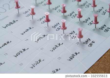 4 day work week printed calendar with pink pins on three days off in week weekend days four day working week concept. Modern approach doing business short workweek. Effectiveness of employees 102555613