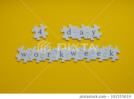 4 day work week symbol on puzzles four day working week concept. Modern approach doing business short workweek. Effectiveness of employees. Productivity and efficiency 102555619