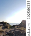 Serene coast and rainbow 102560335